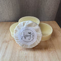 Handmade soap with a 'Amy's Handmade Soap' label on a wooden surface.