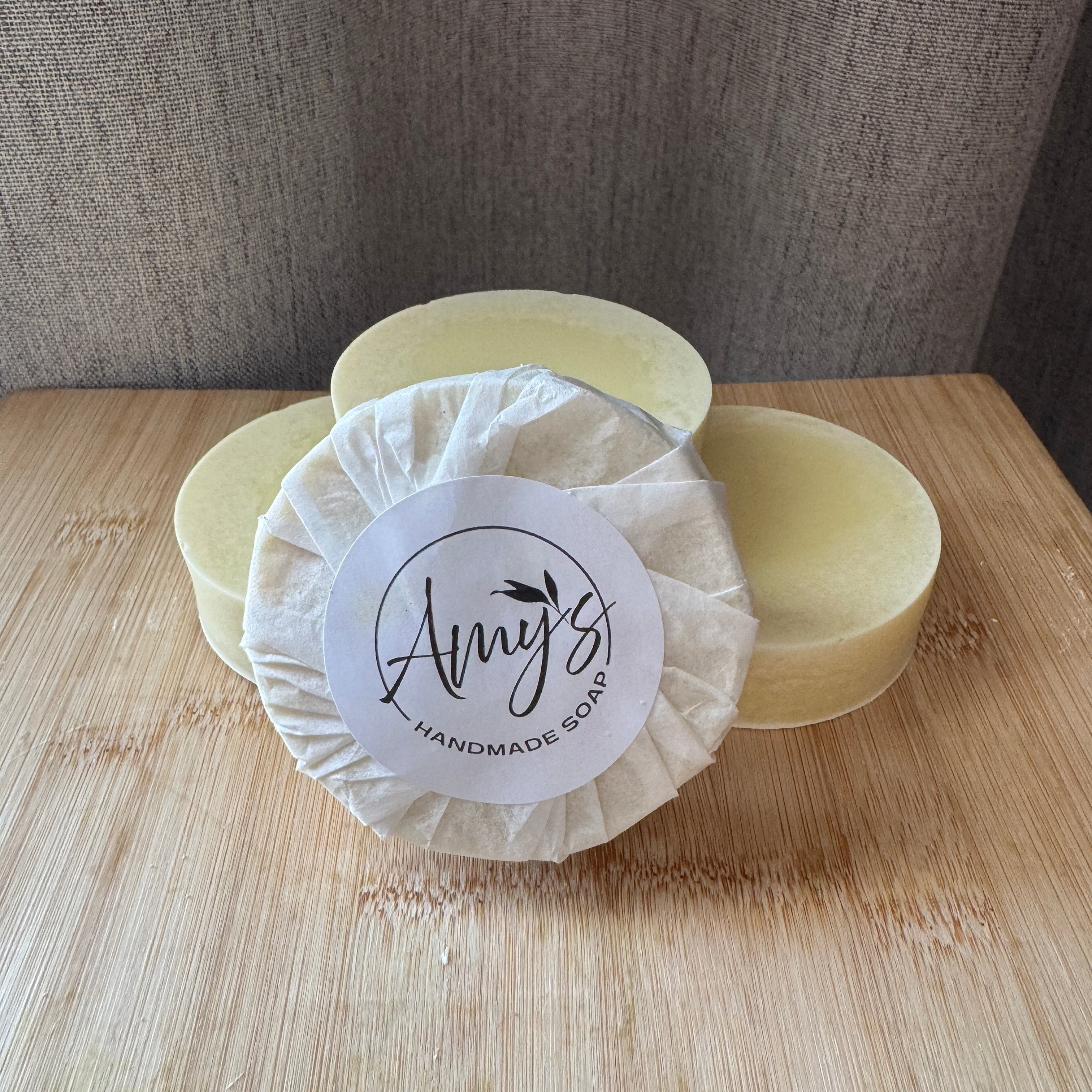 Handmade soap with a 'Amy's Handmade Soap' label on a wooden surface.