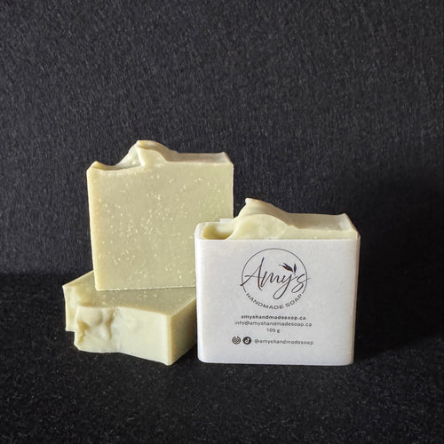 3 bars of handmade soap light green on a dark black background