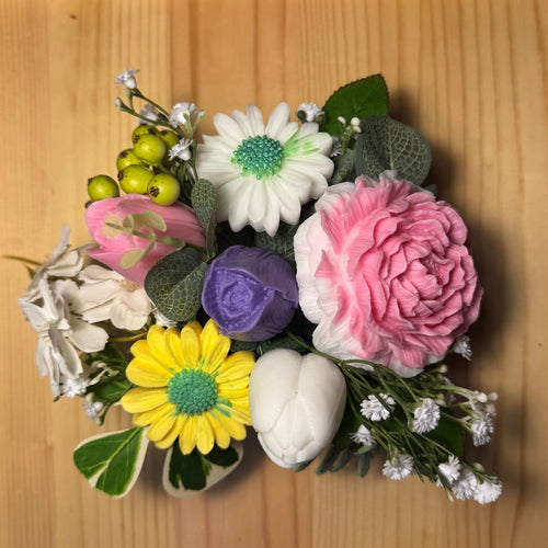 Colorful flower arrangement on a wooden surface