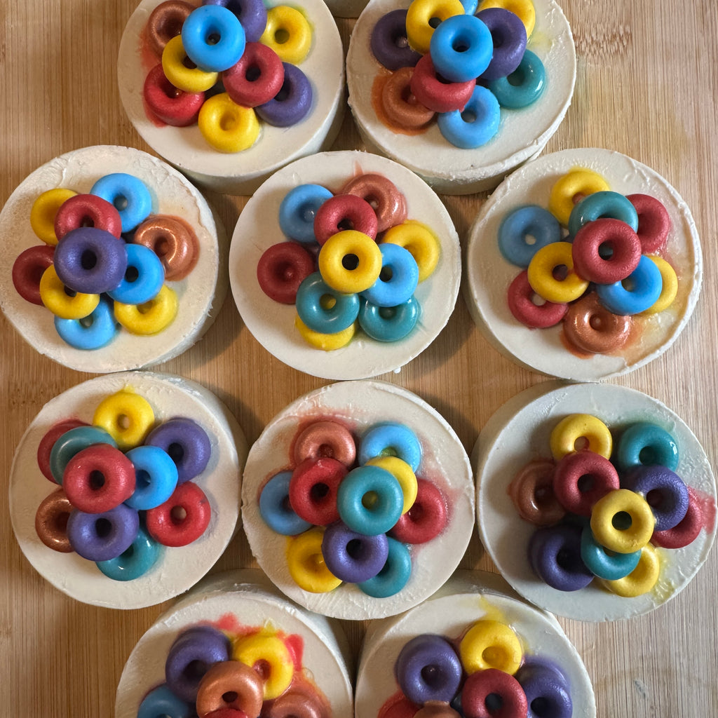 white circular soaps topped with colourful rings