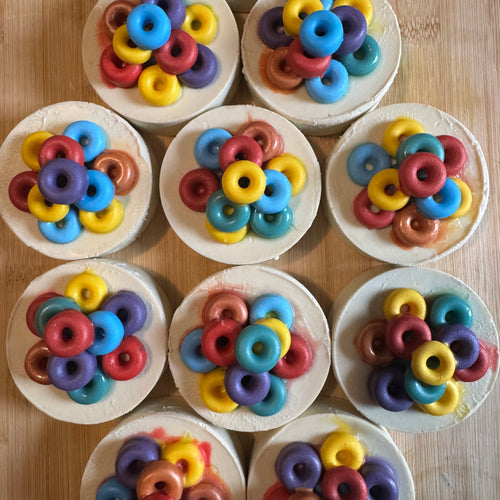 white circular soaps topped with colourful rings