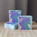 a purple white and green swirled soap