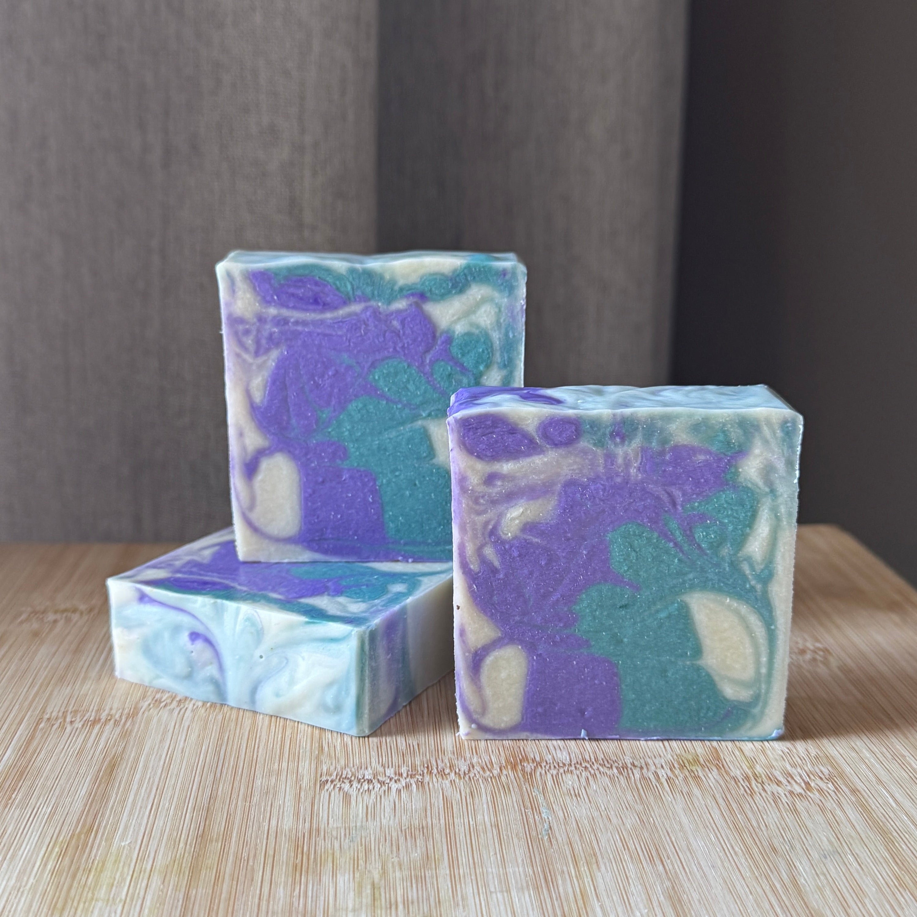 a purple white and green swirled soap
