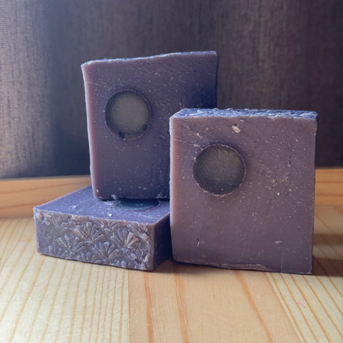 3 dusty purple soaps with twinkling mica and a clear moon embed