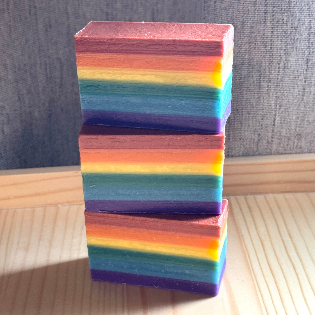 a stack of 3 rainbow soaps