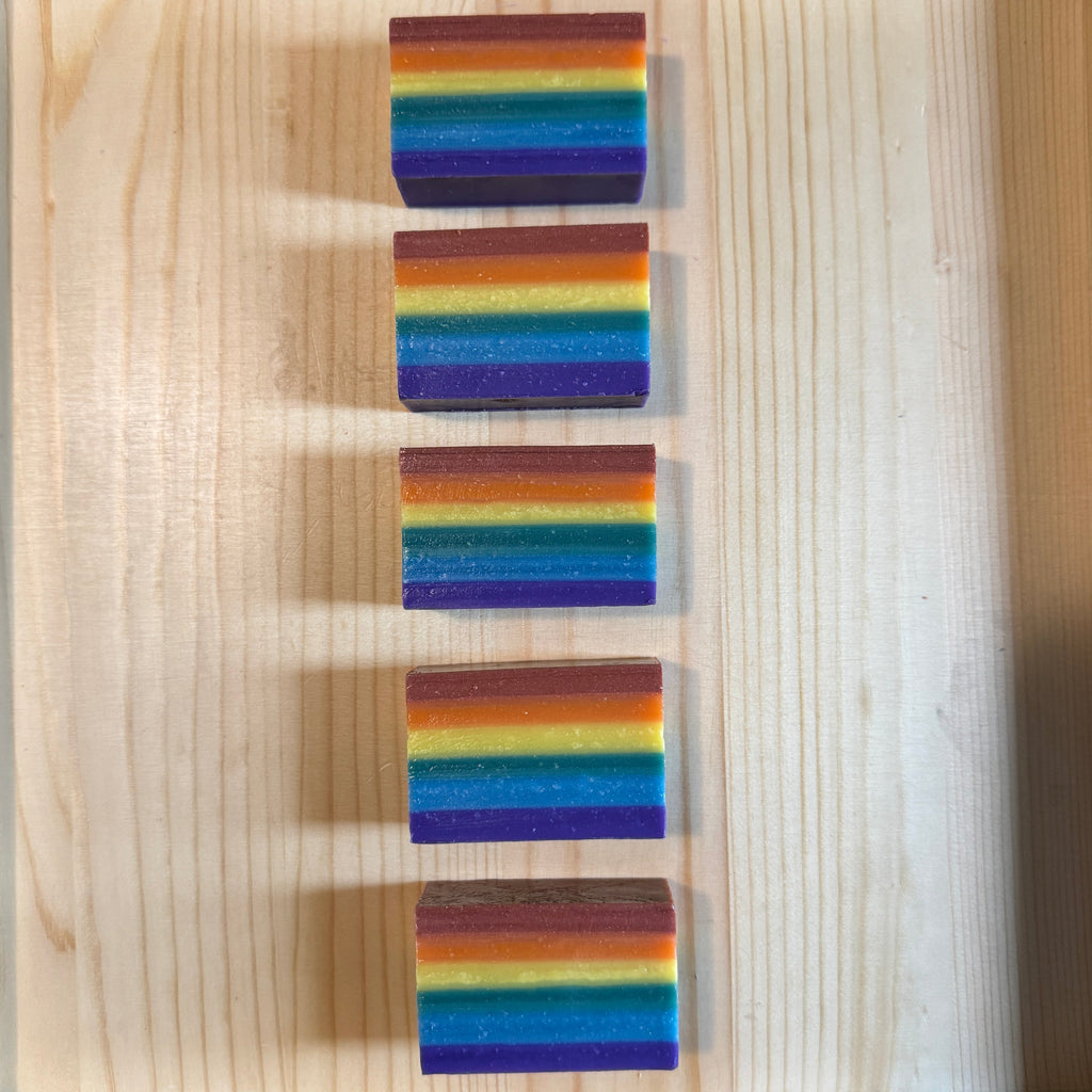 5 rainbow soaps arranged in a line