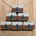 6 bars of soap brown and white with a green evergreen tree embed