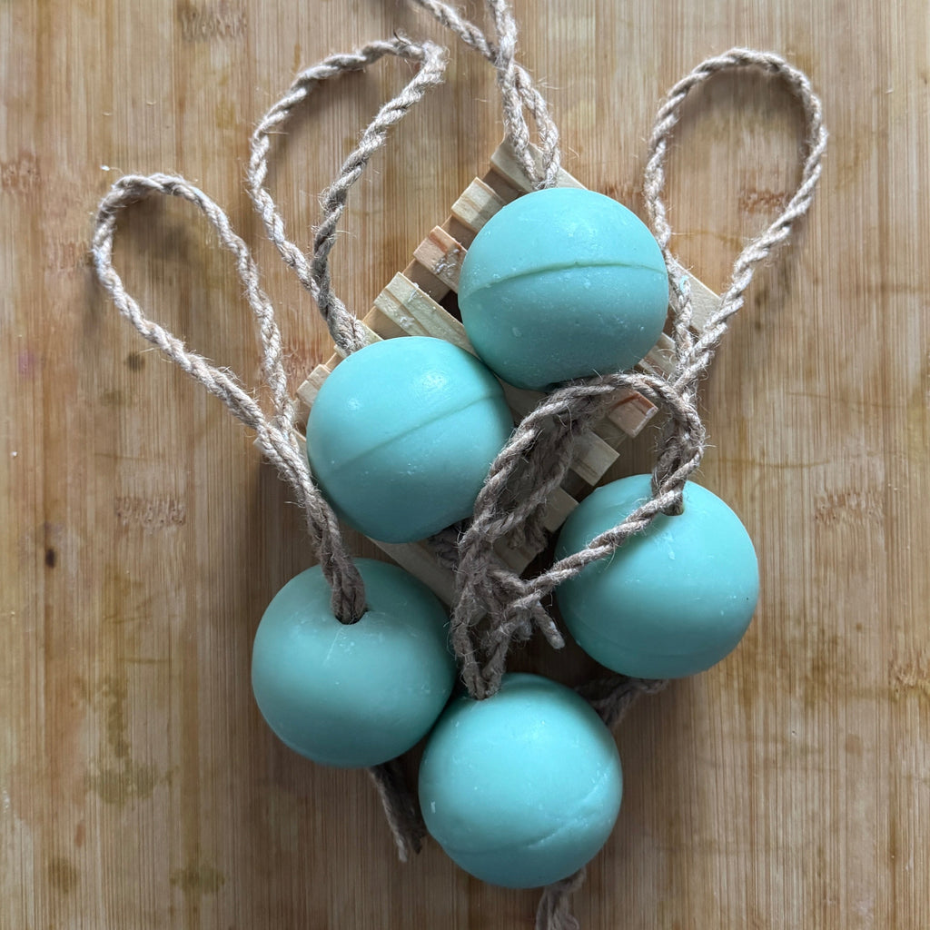 round balls of soap on a twine rope